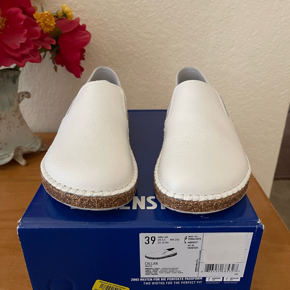 Birkenstock white flats.